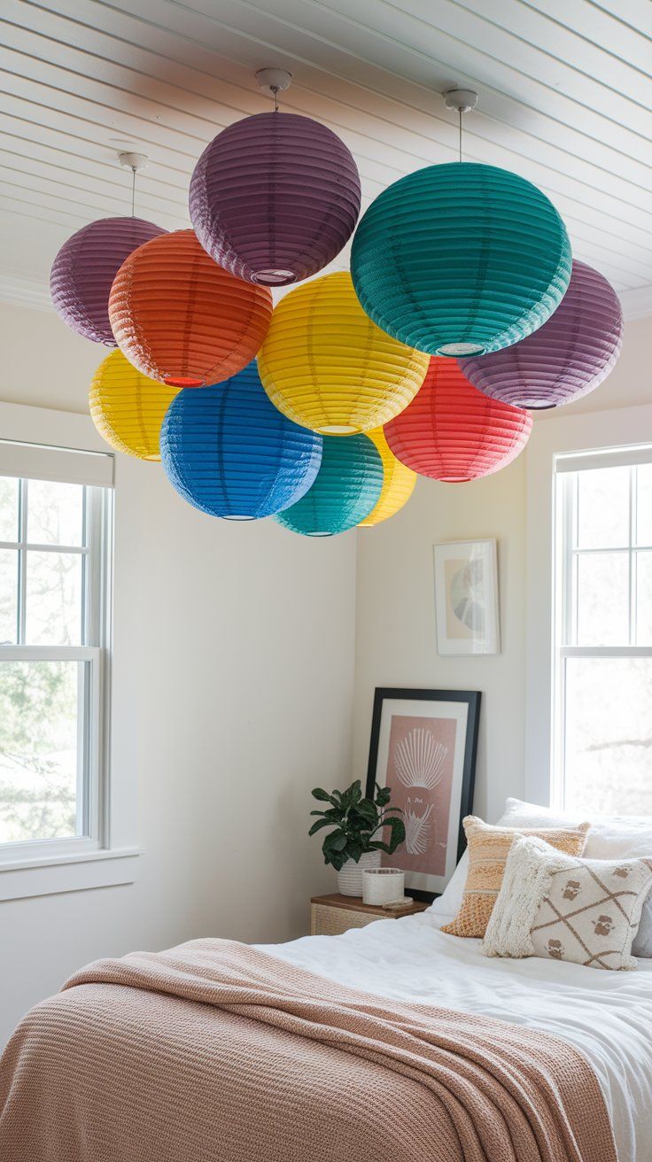 Hanging rainbow paper lanterns adding movement and celebration to kids’ room